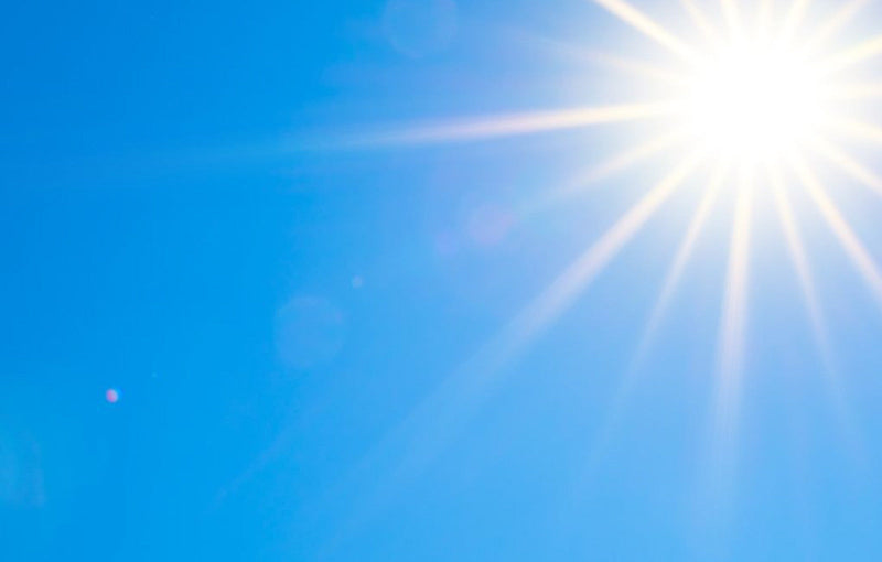 Bright Sun Rays In Perfect Blu Sky